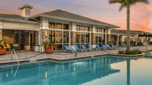 outdoor pool space surrounded by chairs at Champions Vue in Davenport FL built by Kimaya